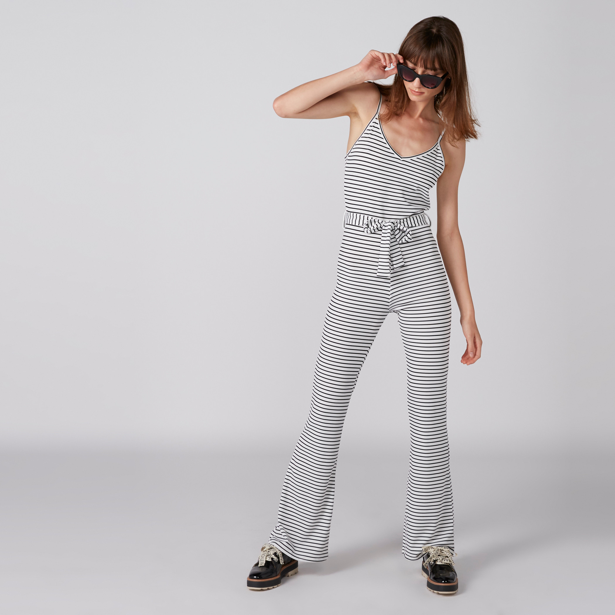 Buy Striped Jumpsuit with Spaghetti Straps and Tie Up Belt Splash UAE