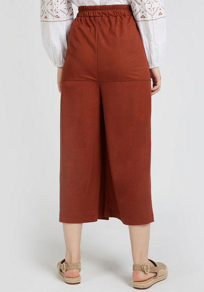 Solid High-Rise Culottes Pants with Pocket Detail and Tie Ups