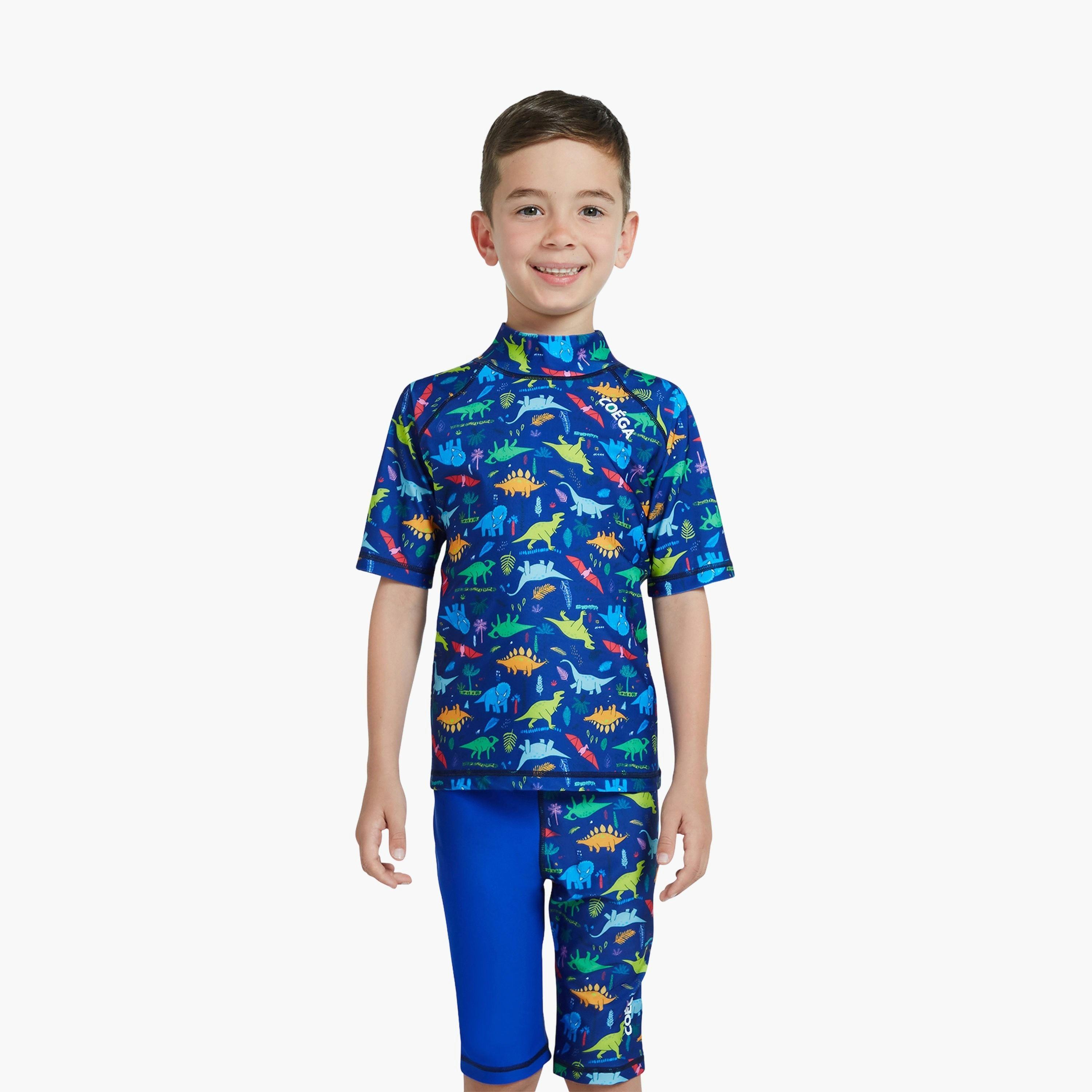 كويغا بويز راش جارد بأكمام قصيرة - ديناصورات كاملة AOP بلو يلعب-boys-clothing-sportswear-swimwear-image-1