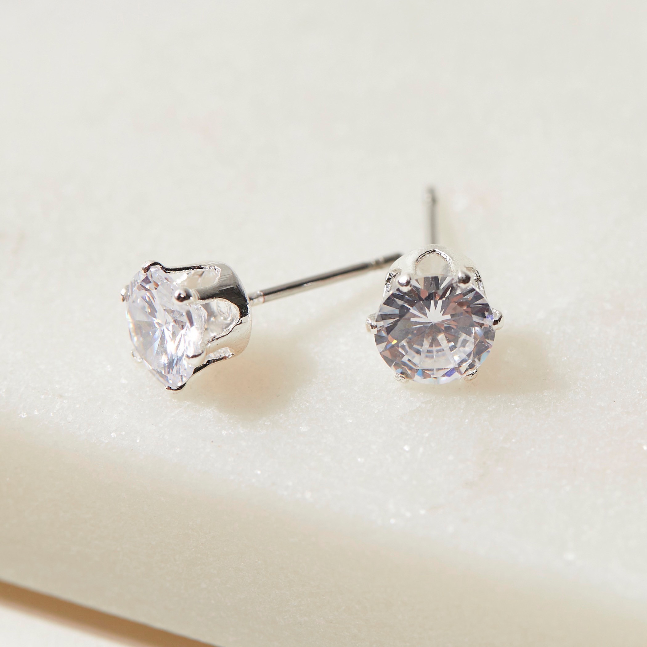 Swarovski white discount gold stud earrings