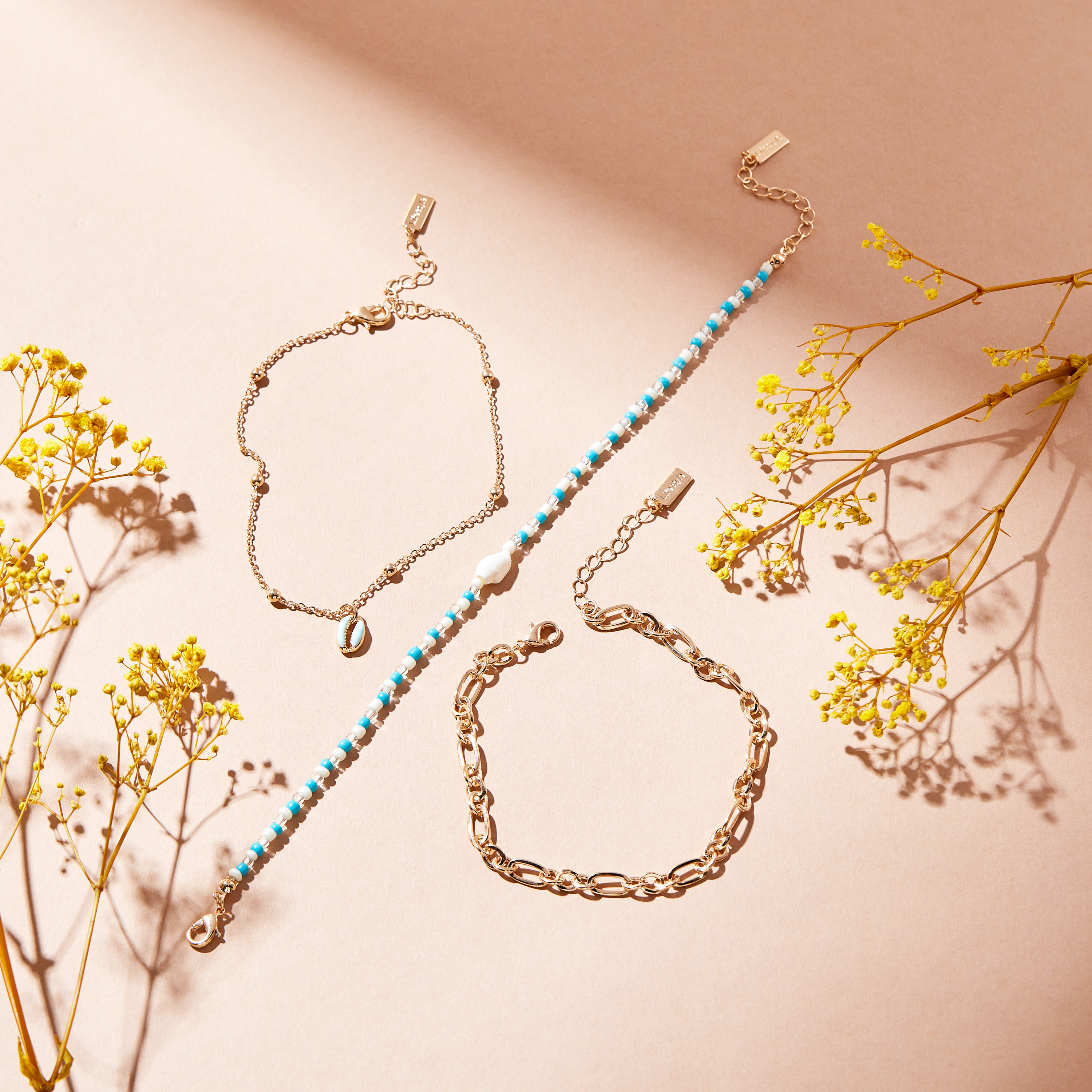 خلاخيل مزينة بالخرز بمشبك إغلاق - طقم من 3 قطع-women-watchesandjewellery-jewellery-anklets-image-3