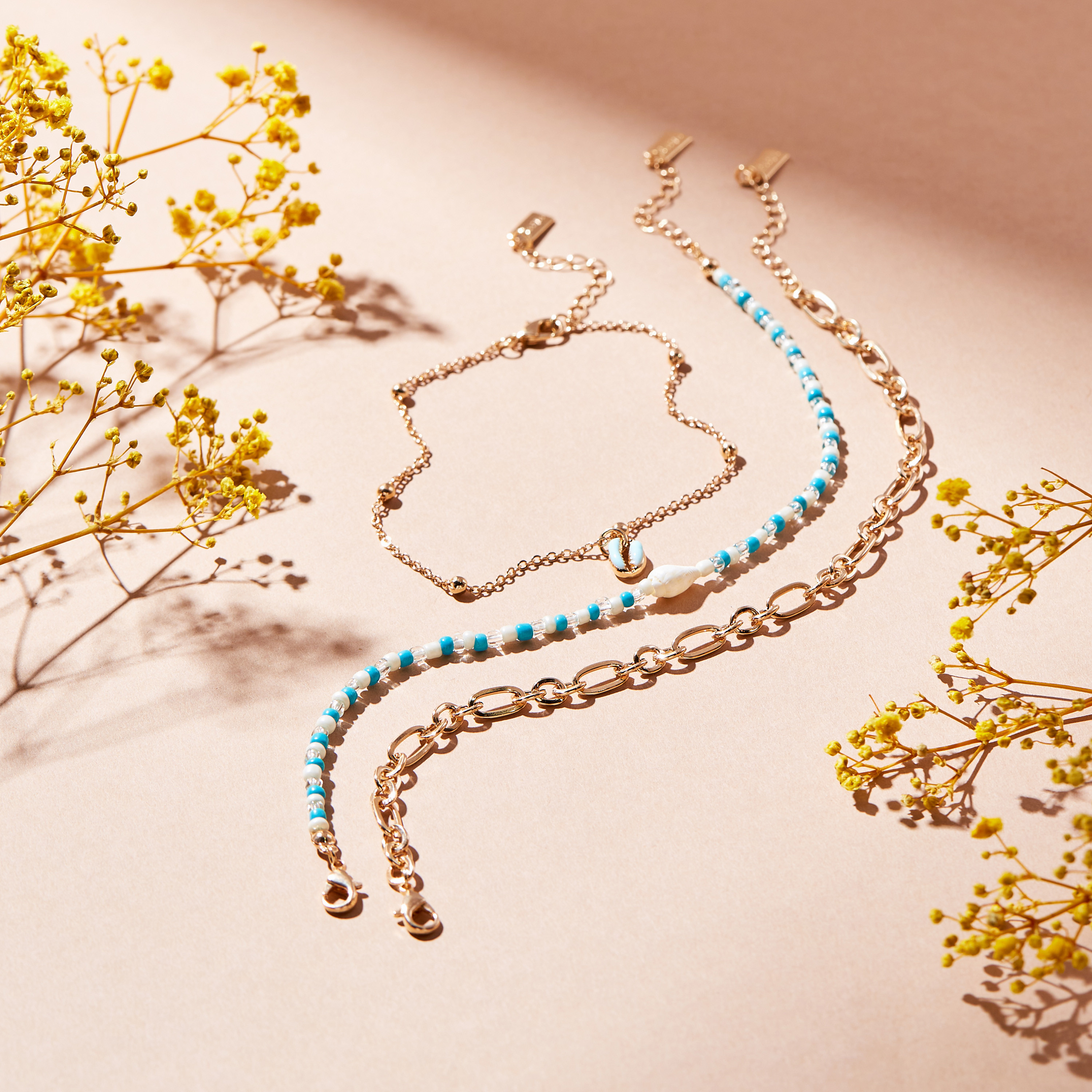 خلاخيل مزينة بالخرز بمشبك إغلاق - طقم من 3 قطع-women-watchesandjewellery-jewellery-anklets-image-2
