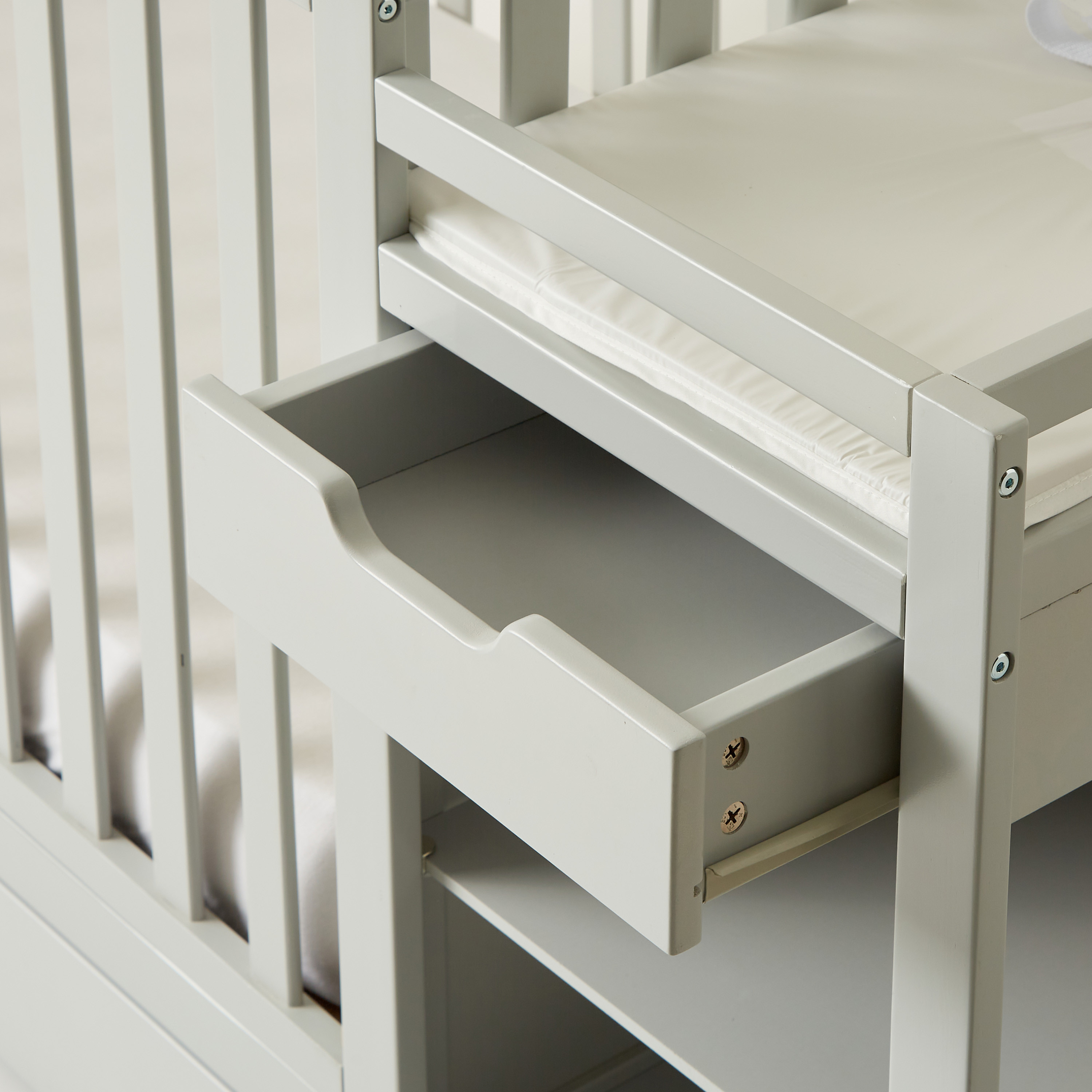 Gray baby crib with hotsell changing table