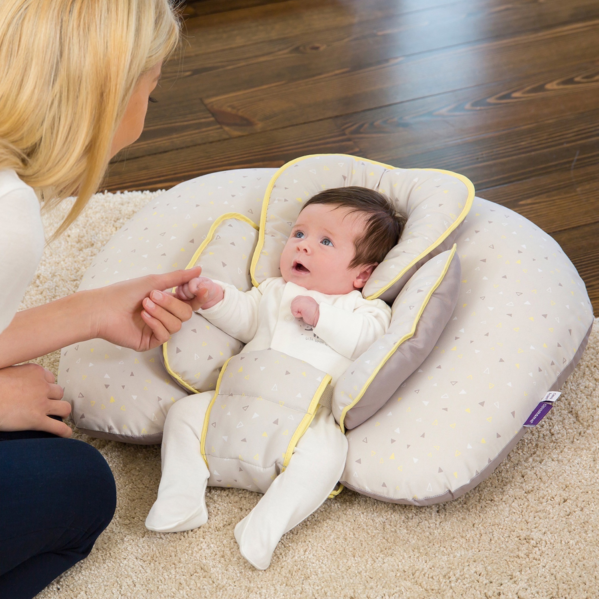 Newborn sleeping on nursing sales pillow