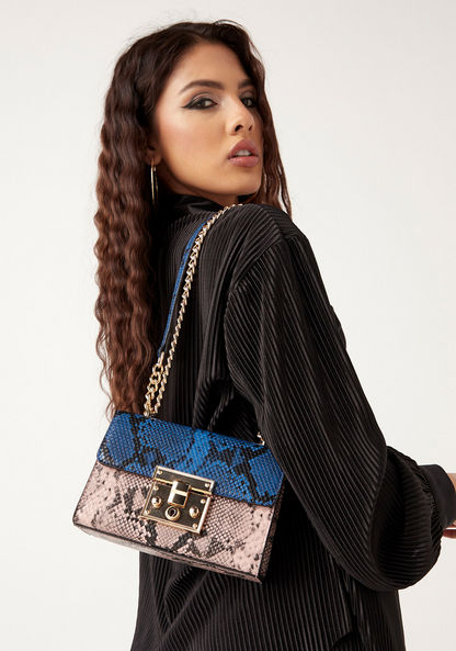 Haadana Animal Print Crossbody Bag with Chain Accented Strap and Clasp Closure