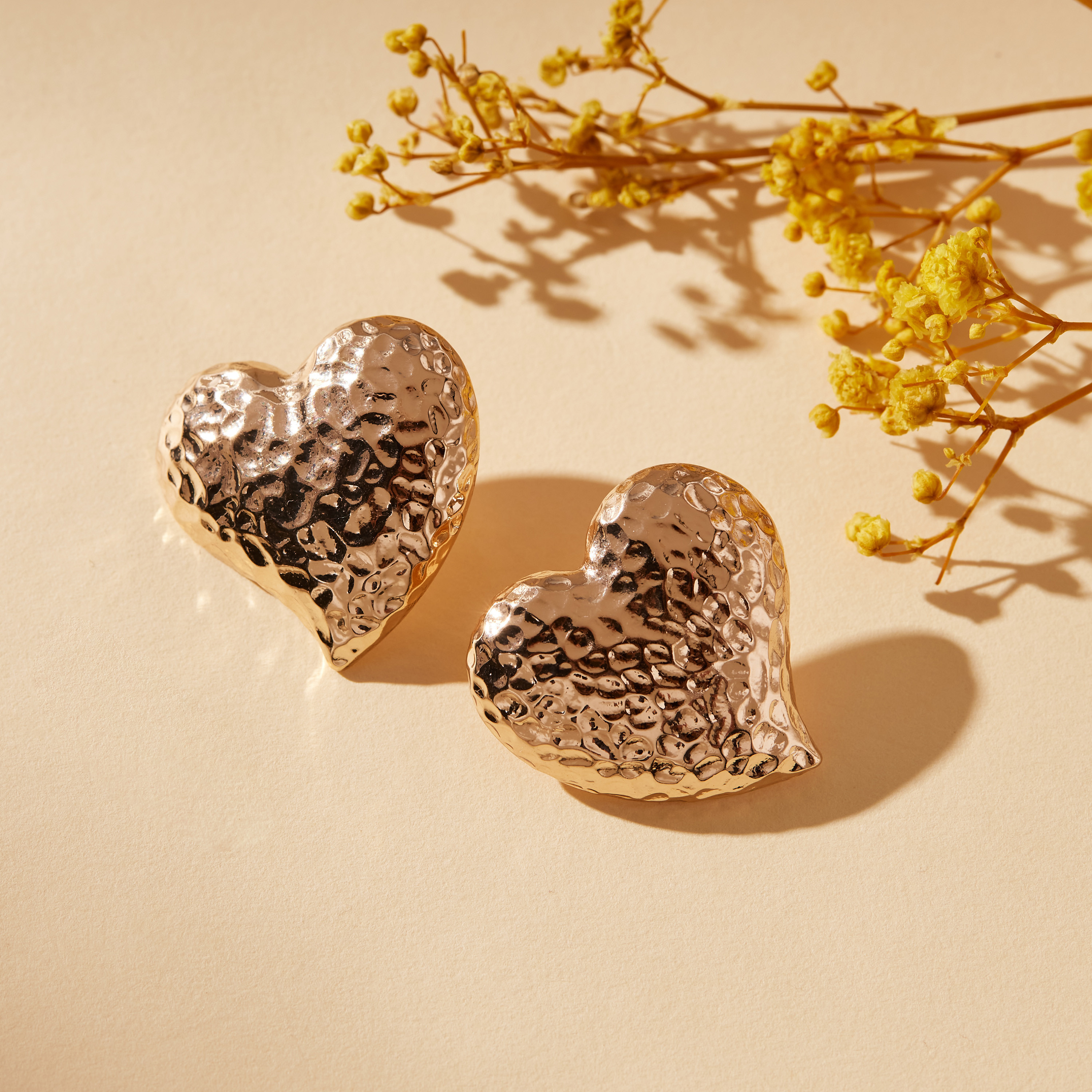 Buy Women s Hammered Textured Heart Shaped Earrings with Pushback Closure Online Centrepoint UAE