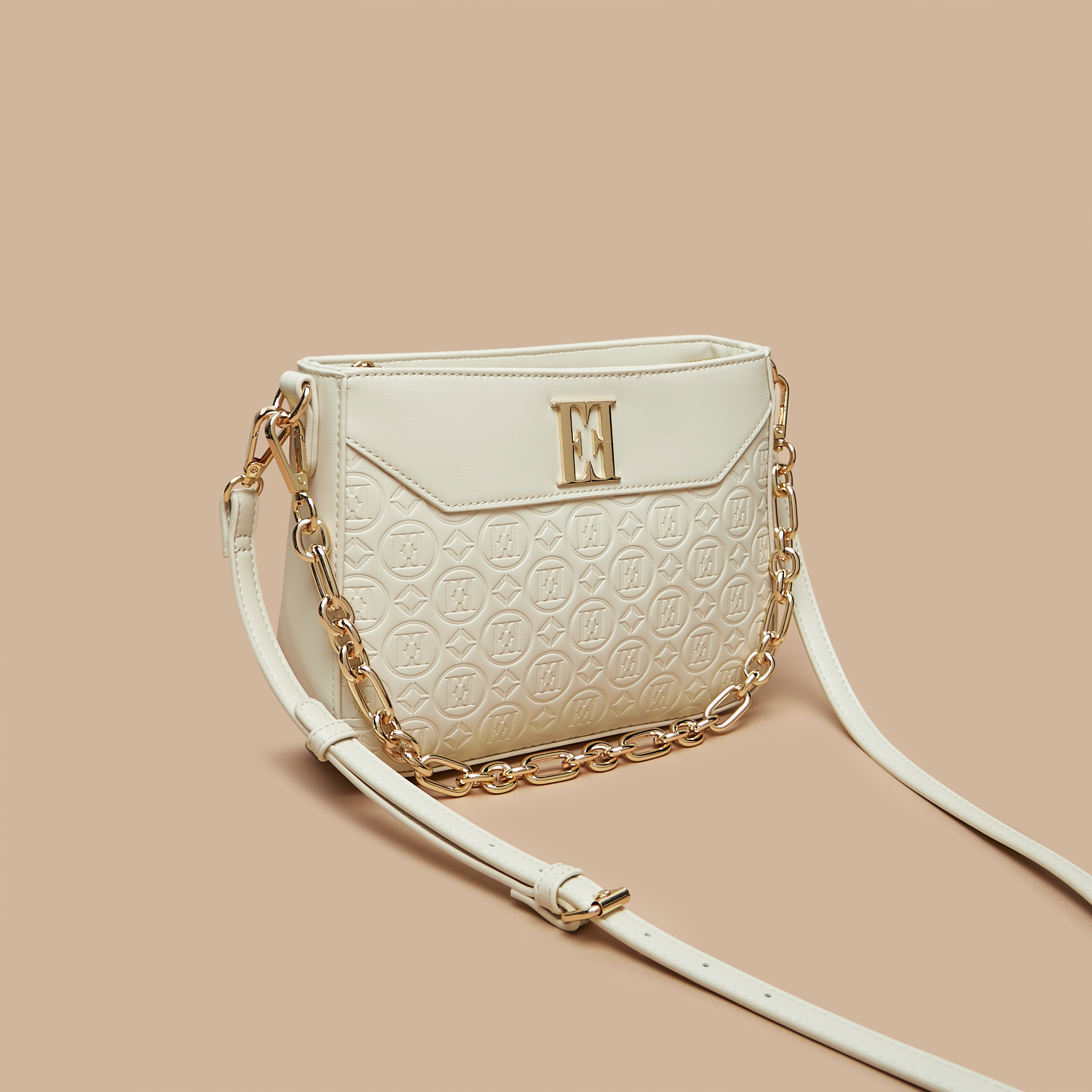 Embossed monogram logo discount shoulder zip bag