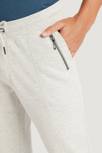 Iconic Solid Jog Pants with Drawstring Closure and Zipper Pockets