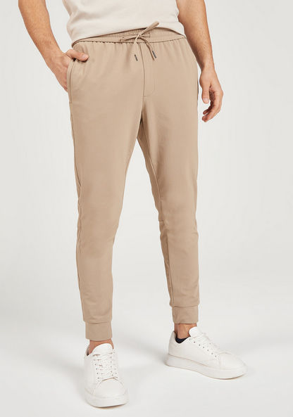 Iconic Solid Joggers with Drawstring Closure and Pockets-Pants-image-0