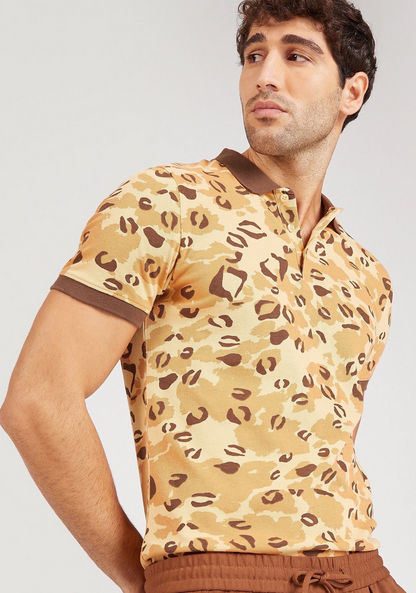 Shop Iconic Animal Print Polo T-shirt with Short Sleeves and Button Closure Online | Splash Bahrain Shop Iconic Animal Print Polo T-shirt with Short Sleeves and Button Closure Online | Splash Bahrain