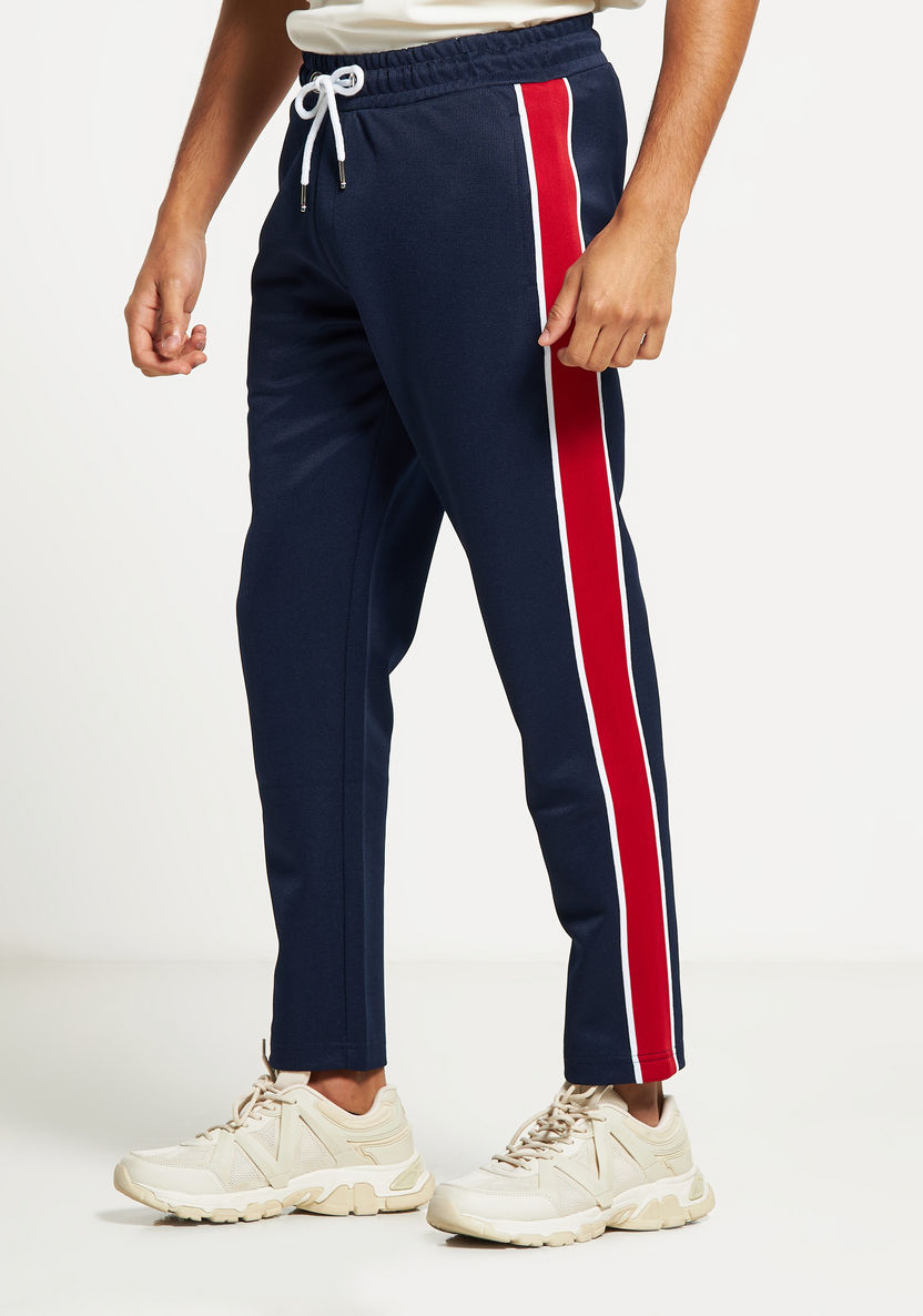 Buy Men's Iconic Tape Detail Track Pants with Drawstring Closure and ...
