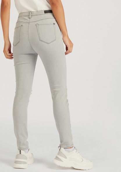 Super Skinny Fit Ripped Jeans with Button Closure