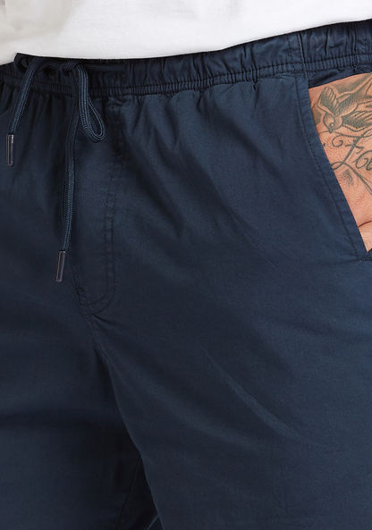 Solid Mid-Rise Shorts with Pocket Detail and Drawstring