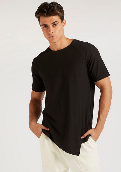 Solid Longline T-shirt with Asymmetric Hem and Crew Neck-T Shirts-image-0