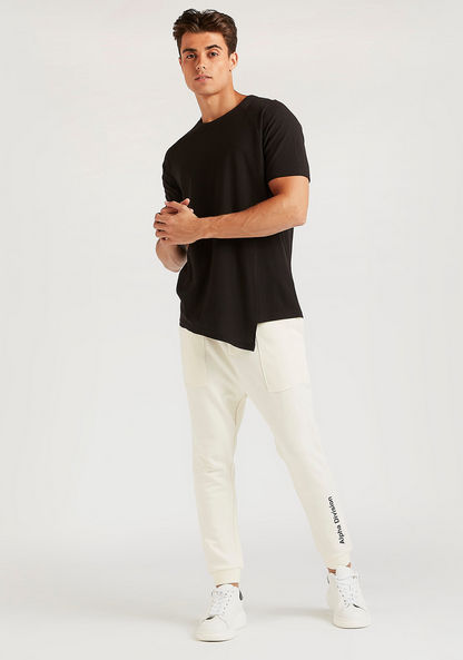 Solid Longline T-shirt with Asymmetric Hem and Crew Neck-T Shirts-image-1