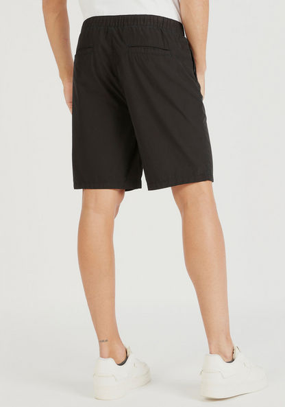 Solid Mid-Rise Shorts with Clip Buckle Closure