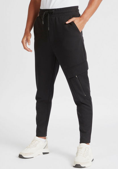Solid Slim Fit Mid-Rise Joggers with Zipper Pockets