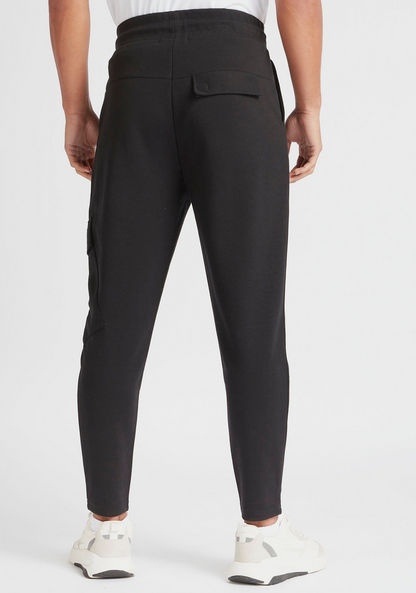 Solid Slim Fit Mid-Rise Joggers with Zipper Pockets
