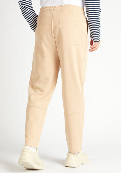 Solid Mid-Rise Track Pants with Drawstring Closure and Pockets