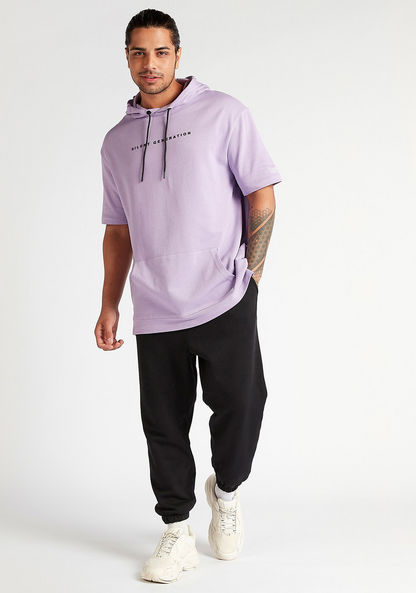 Oversized Printed Hooded T-shirt with Short Sleeves and Kangaroo Pocket