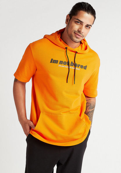 Slogan Print Oversized Hooded T-shirt with Kangaroo Pocket and Short Sleeves