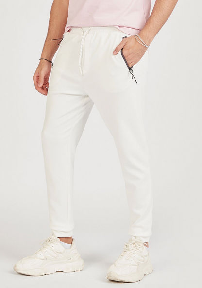Solid Mid-Rise Joggers with Drawstring Closure and Zipped Pockets-Joggers-image-0