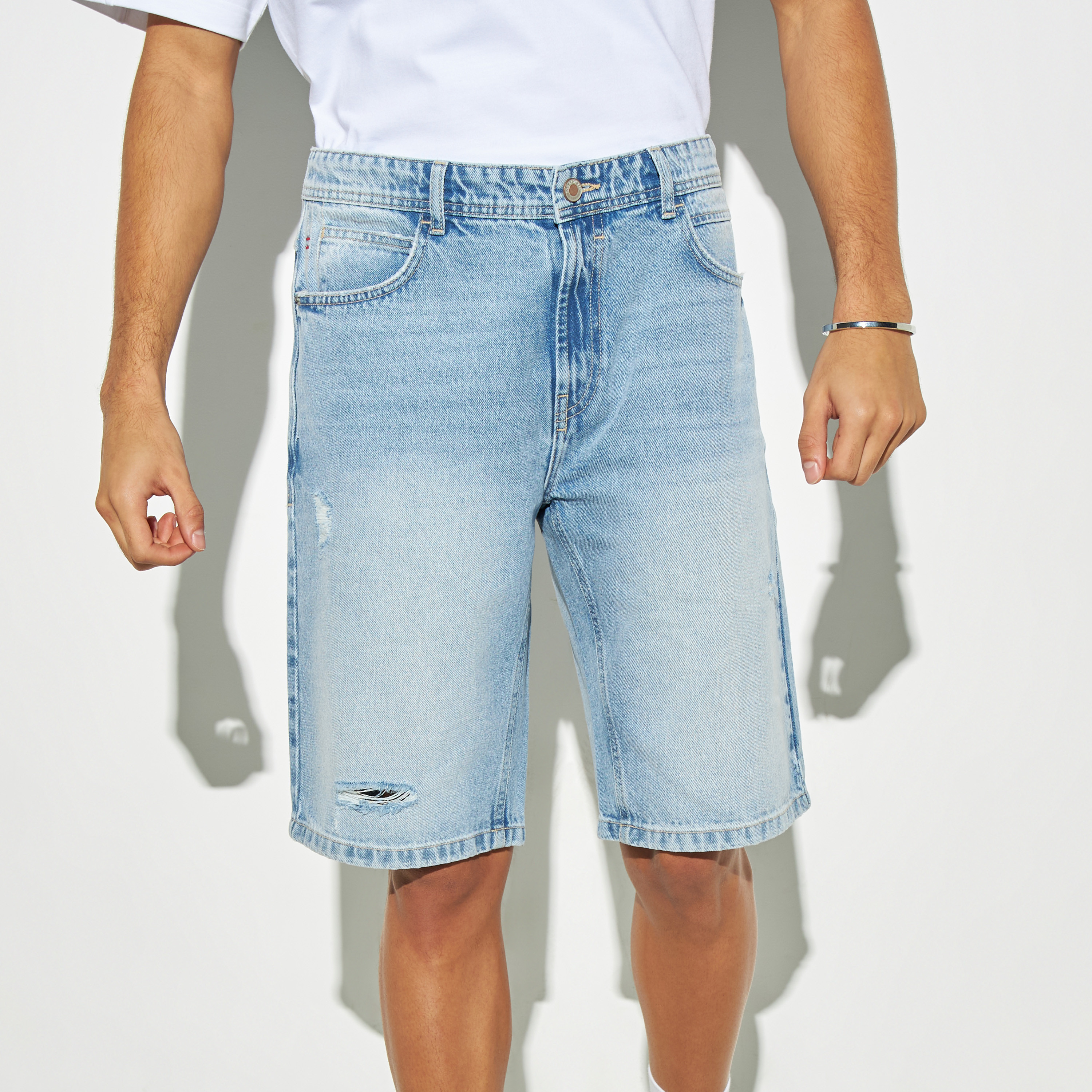 Distressed shorts clearance with pockets showing