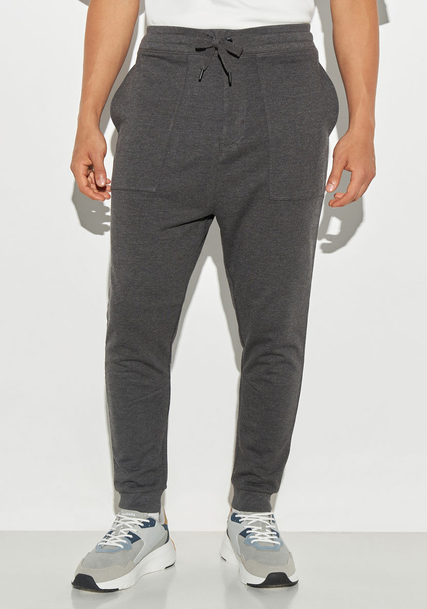 Buy Men's Solid Joggers with Drawstring Closure and Pockets Online ...