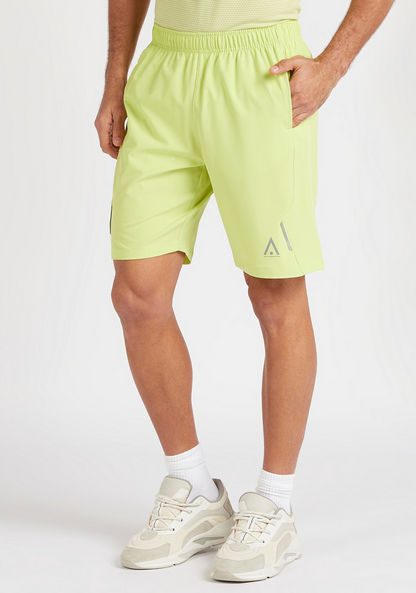 Solid Panelled Shorts with Zipper Pockets and Elasticated Waist