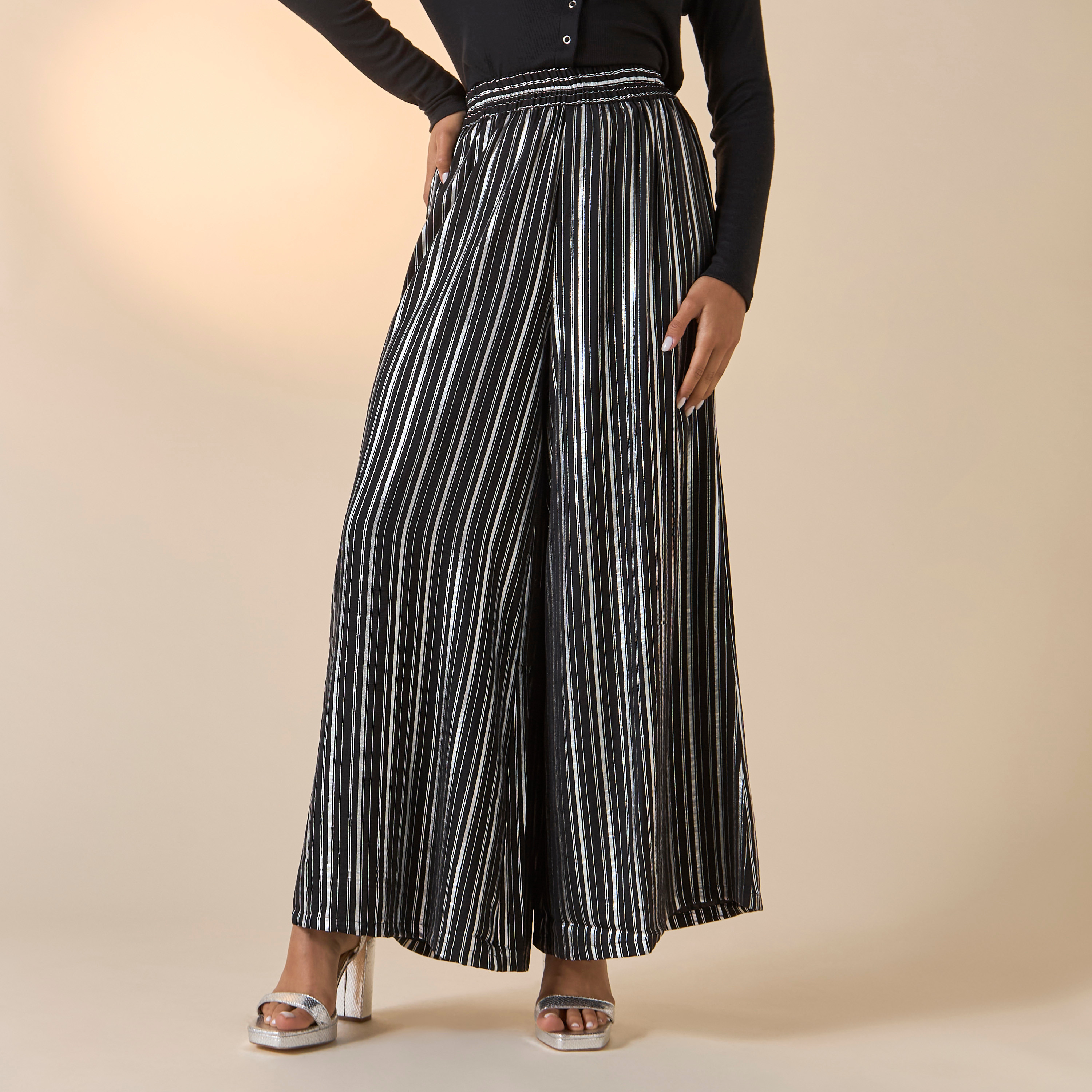 بنطلون مخطّط واسع الساقين بخصر مطاطي من جولدن آبل-women-clothing-bottoms-trousers-image-5