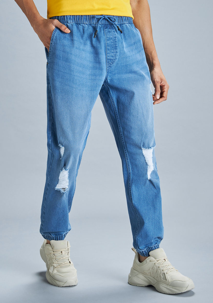 Buy Distressed Denim Joggers with Drawstring Closure and Pockets