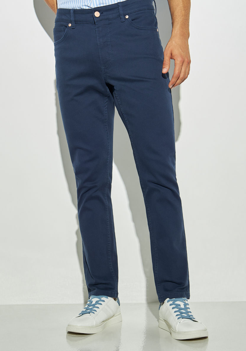 Buy Men's Slim Fit Solid Jeans with Button Closure Online | Centrepoint UAE
