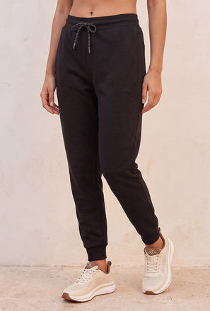 بنطلون رياضي مطاطي ثنائي الاتجاه من كابا-women-clothing-sportswearandactivewear-bottoms-image-1