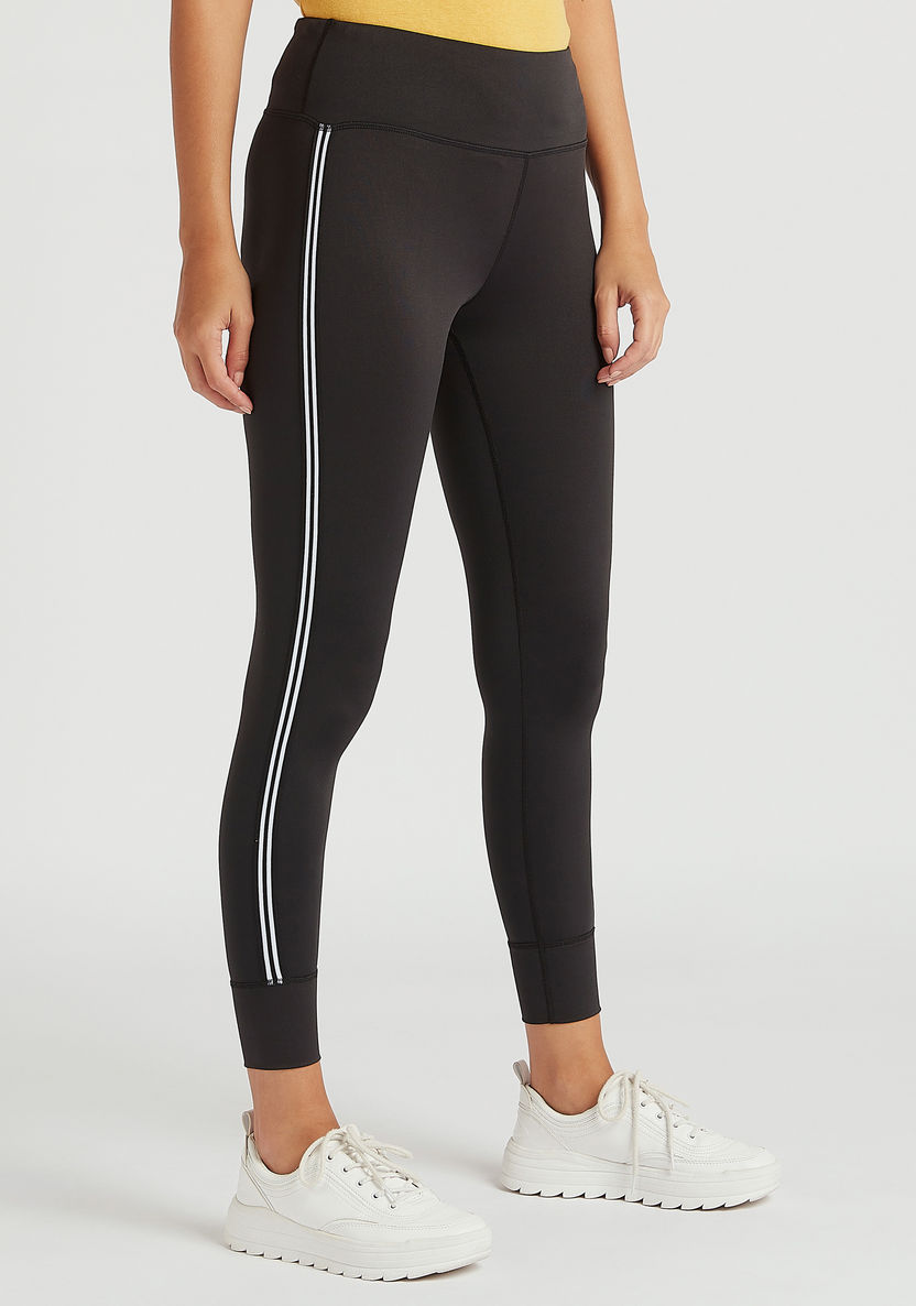 Buy Solid Leggings with Tie Ups and Zipper Pocket