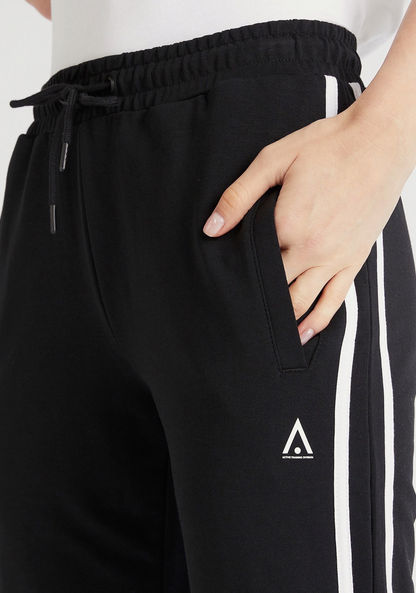 Solid Full-Length Track Pants with Side Tape Detail and Pockets