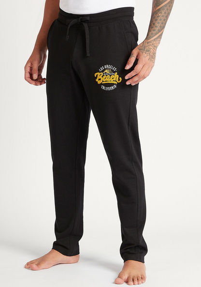 Solid Full Length Pyjamas with Embroidered Details and Drawstring Closure