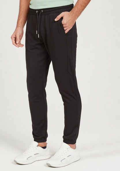 Solid Cut and Sew Joggers with Drawstring Closure and Pockets-Joggers-image-0