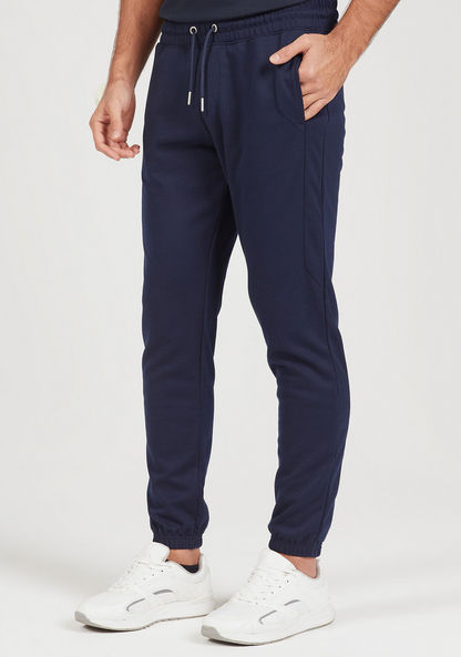 Solid Cut and Sew Joggers with Drawstring Closure and Pockets-Joggers-image-0
