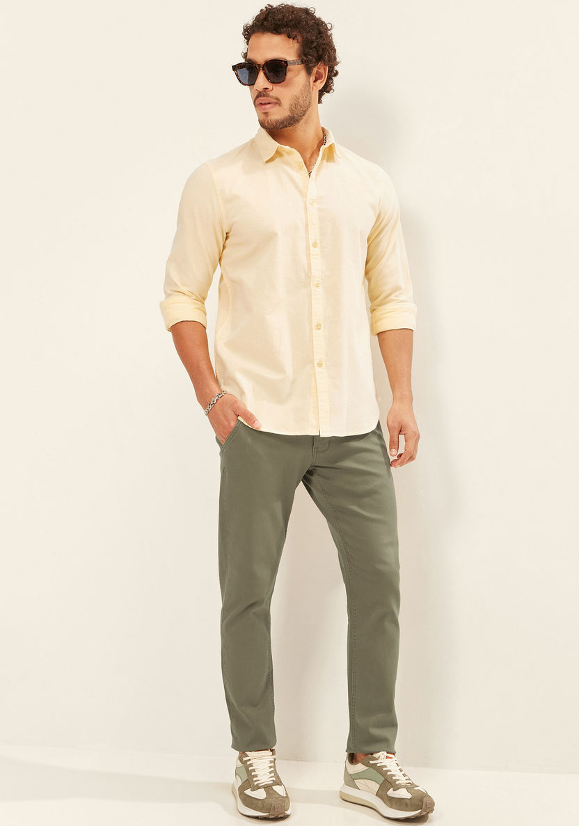 Buy Men's Solid Trouser with Button Closure and Pockets Online ...