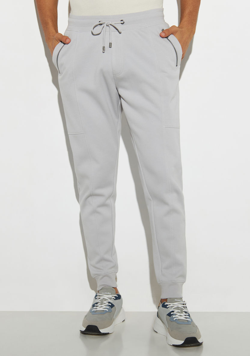 Buy Iconic Solid Relaxed Fit Joggers with Drawstring Closure and ...