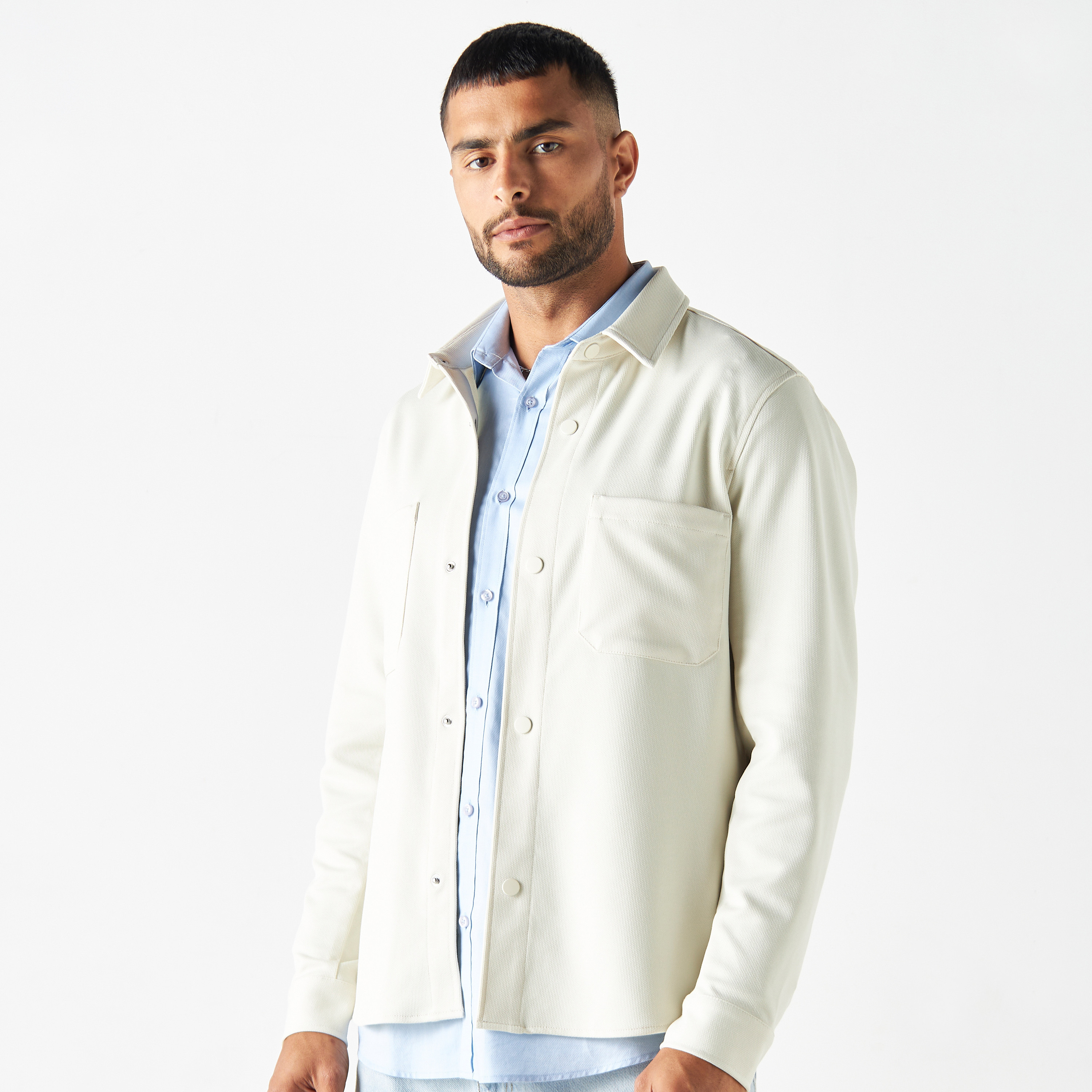 Buy Men s Textured Button Up Jacket with Chest Pockets and Long Sleeves Online Centrepoint Bahrain