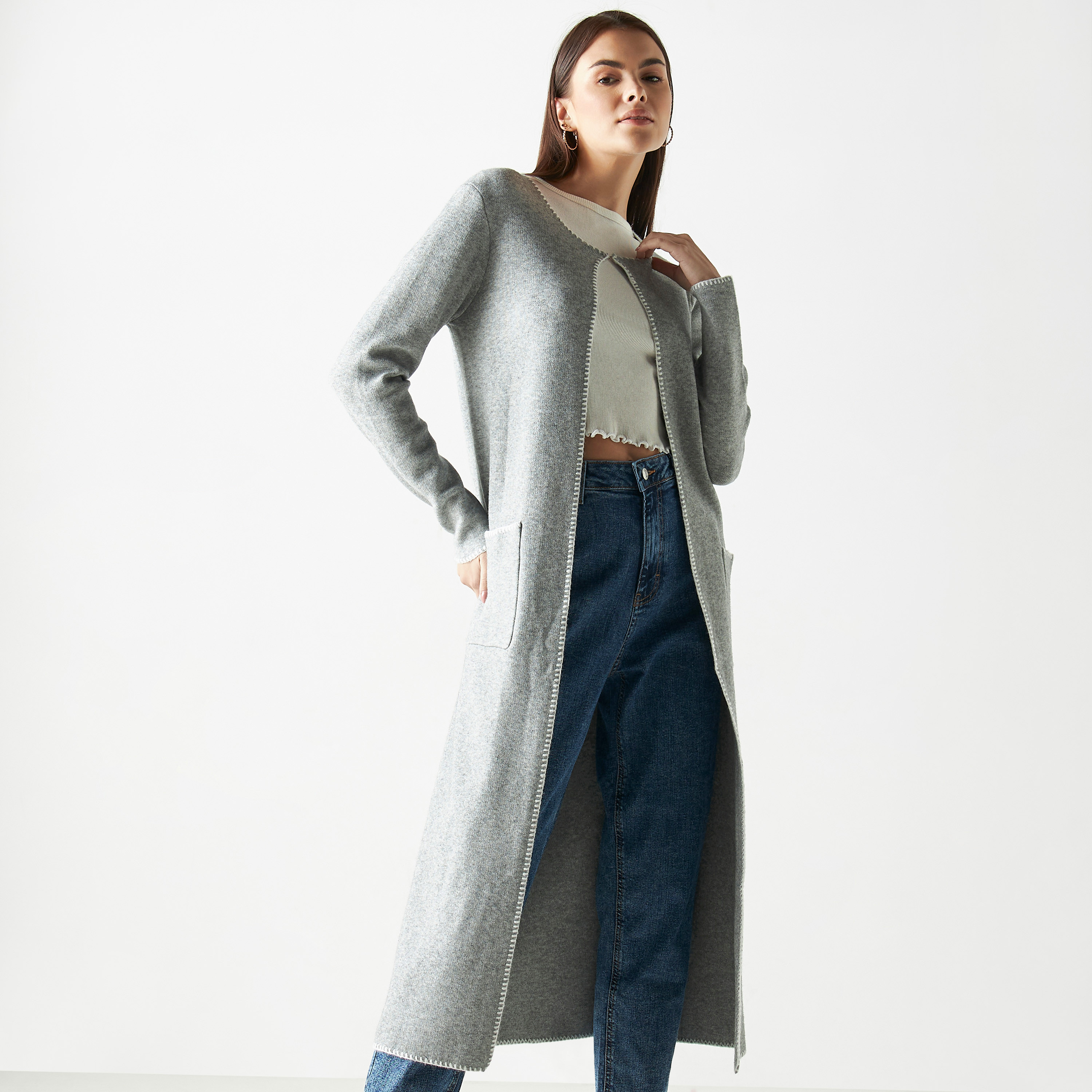 Buy Women s Solid Blanket Stitch Detail Longline Shrug with Button Closure and Pockets Online Centrepoint UAE