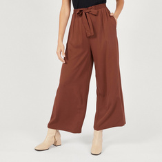 Solid Palazzo Pants with Pockets and Tie-Up Detail