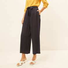 Solid Mid-Rise Palazzo Pants with Tie-Up Detail and Pockets