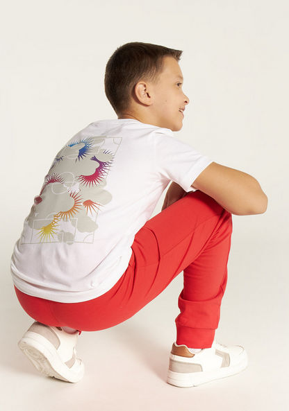 PUMA Graphic Print T-shirt with Short Sleeves and Round Neck