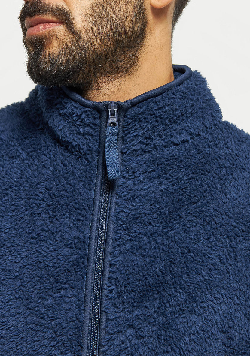 Buy Men's Textured Zip Through Sleeveless Jacket with Pockets Online ...