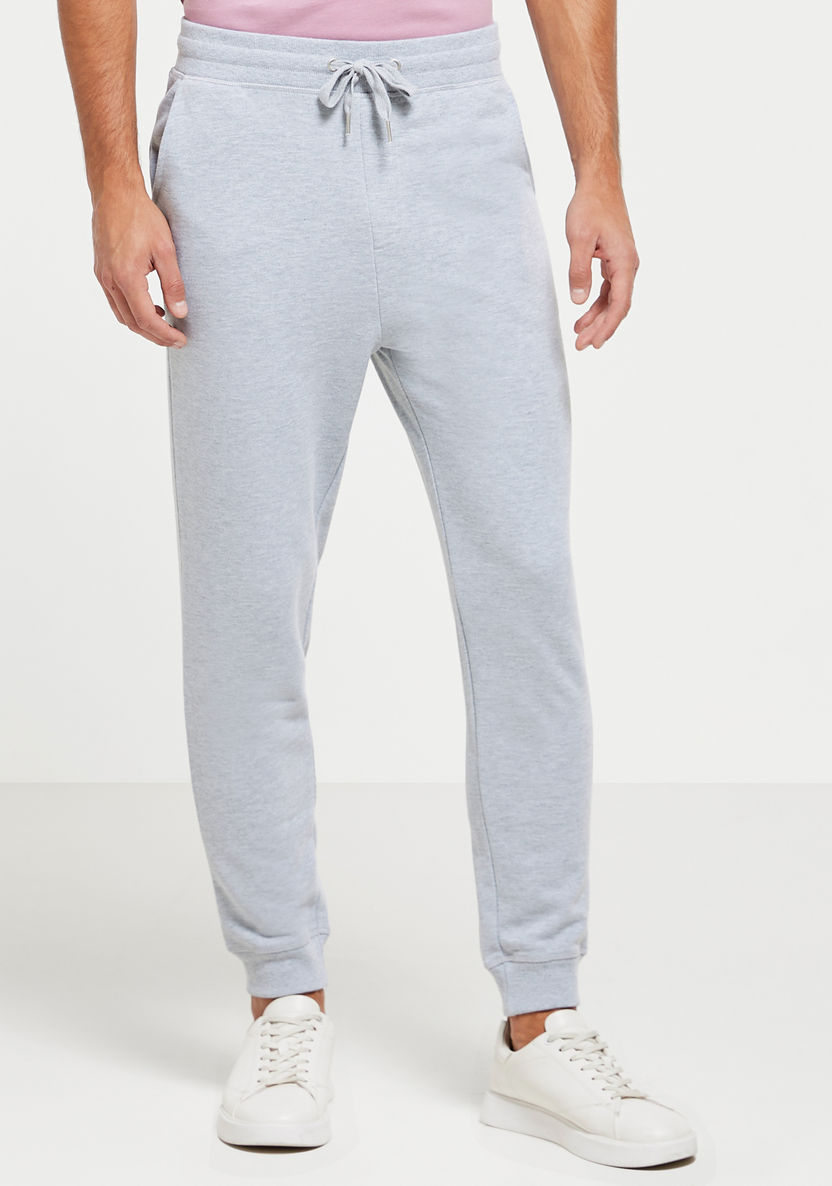 Buy Men's Solid Mid-Rise Joggers with Drawstring Closure and Pockets ...