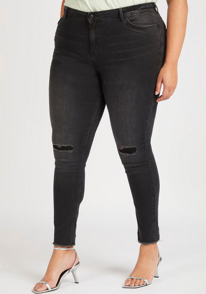 Ripped Skinny Jeans with Button Closure