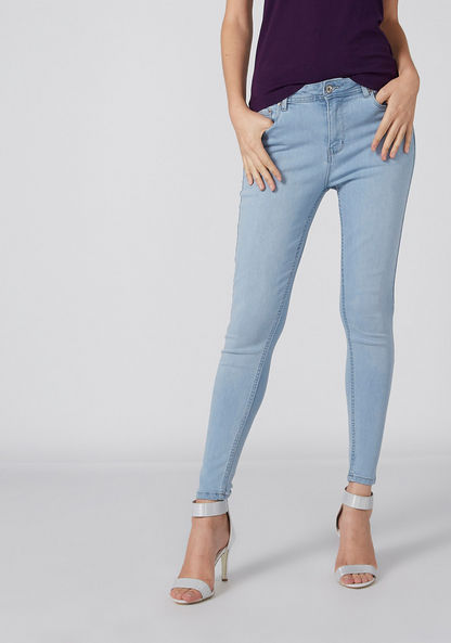 Solid Mid-Rise Denim Jeans with Pockets and Button Closure