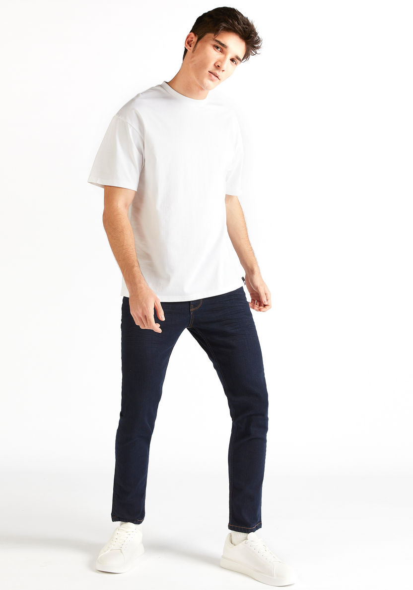 Buy Men's Solid Denim Jeans with Button Closure and Pockets Online ...